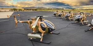 MD 530F helicopters at a hanger.
