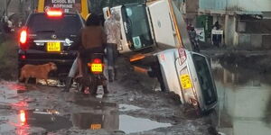 A lorry and a car pictured after falling into a ditch on the Zebra-Kincar Road on March 9, 2020 in Machakos County