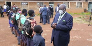 Education CS George Magoha conversing with 2020 KCPE Candidates