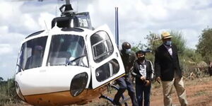 Makueni Governor Kivutha Kibwana stepping out of Deputy William Ruto's helicopter.