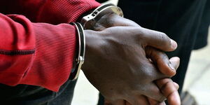 A file photo of man in handcuffs 