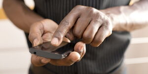 File image of a man using a phone