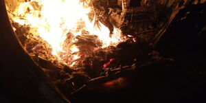A saloon car filled with marijuana pictured after it burst into flames following an accident in Mtito Andei, Makueni County on Tuesday, March 10