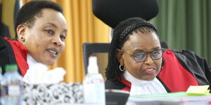 Chief Justice Martha Koome and DCJ Philomena Mwilu consulting at the Supreme Court of Kenya on Friday, September 2, 2022.