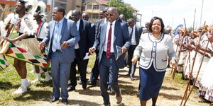 A photo of Embu Governor Martin Wambora (left), Communications Authority of Kenya Chairman Ngene Gituku and Communications Authority Ag. Director-General Mercy Wanjau during the County's ICT Forum at Embu University ground on November 28, 2019.