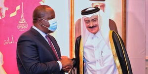 Interior CS Fred Matiang'i (left) and his Qatari counterpart and Prime Minister Sheikh Khalid bin Khalifa bin Abdulaziz Al-Thani in Nairobi during Qatar's National Day celebrations on Friday, December 10, 2021