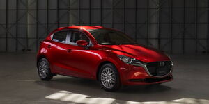 A brand new Mazda car in a showroom.