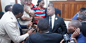 Tanzanian opposition leader and Chadema chairman Freeman Mbowe in court with his lawyer in Dar es Salaam, Tanzania.