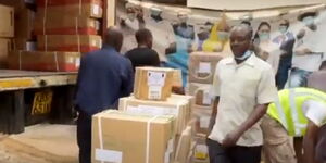 A screen grab of workers offloading drugs from a lorry.