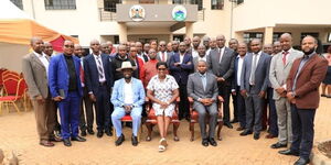 Meru Governor Kawira Mwangaza (center), her spouse Murega Baichu (on her left) and other county officials