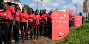 A photo of models at a mock queue along Mombasa Road, Nairobi during the launch of a countrywide campaign by the Kenya Revenue Authority (KRA) to sensitise all taxpayers to adopt the online platform iTax to file returns in 2015.