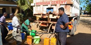 Mombasa Cement Limited owner and director Hasu Patel supplies water to Mombasa Residents in 2021.
