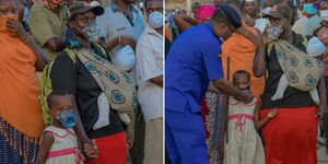 Mombasa Police Commander Rashid Yakub hands a woman and her daughter face masks as they wait for the ferry to arrive in Likoni on Monday, March 31, 2020.