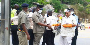 Mombasa Politician Salim Mohamed hands out free masks to police officers on April 4, 2020.