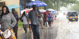 Mombasa residents walk to work in the rain