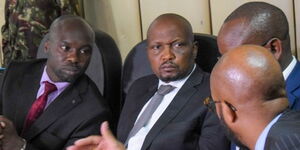 Moses Kuria (centre) appearing before the IEBC Code of Conduct implementation Committee at the IEBC headquarters on March 30, 2022