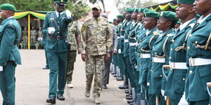 Moses Kuria inspecting a guard of honour at the NYS Headquarters on October 25, 2023.