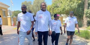 Moses Kuria walking with his friends and family in Dubai on February 12, 2022.