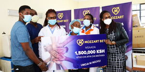 Mozzart Officials and Hospital staff at Waithaka Health Center in Nairobi.