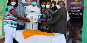 Mozzart team presents a specialized Continuous Positive Airway Pressure therapy (CPAP) machine to Pumwani Hospital in Nairobi