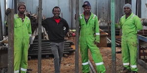 Mugo Macharia (in black) with his employees at their site in Kikuyu on May 7, 2021.