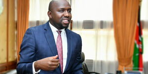 A photo of the Senate Majority Leader Kipchumba Murkomen with a cake in his office.