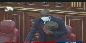 Elgeyo Marakwet Senator Kipchumba Murkomen holds his cap in the Senate on September 8, 2020