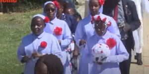 Margaret Wairimu and her bridesmaids matching to church during her wedding in Kiamaina, Laikipia County on January, 8, 2023