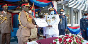 Gen Samson Mwathethe signs over the change of the command certificate at the Defence headquarters in Nairobi on Friday, May 8, 2020.