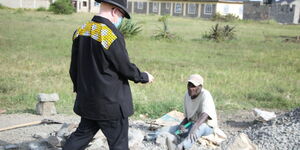 Nominate MP Isaac Mwaura (standing) with David Kang'ee of Gatongora ward on Wednesday May 6.