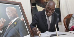 Uasin Gishu politician Jackson Kibor signs a condolence book at the late Mzee Daniel arap Moi's Kabarak house in February 2020
