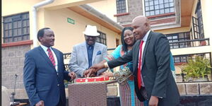 From left: Wiper leader Kalonzo Musyoka, ODM's Raila Odinga, Ida Odinga and Makau Mutua cut a cake during the opening Kitui Villa Hotel on July 10, 2018. 
