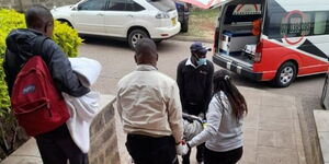 Photo of a Patient being taken to an Ambulance