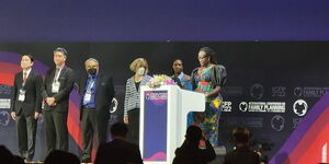 NMG reporter Angela Oketch (in African attire) making her speech at the ICFP 2022 in Pattaya Thailand on Thursday November 17, 2022