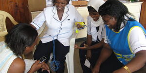 Undated Photo of Nurses Engaging in a Conversation 