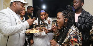 Nairobi Governor Mike Sonko and exchanging some cake with his daughter Saumu during his birthday party on March 4, 2020.