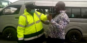An image of a police officer assaulting a motorist