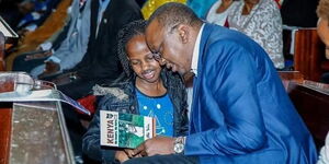 Author Natalie Wambui (left) pictured when she met President Uhuru Kenyatta in 2017