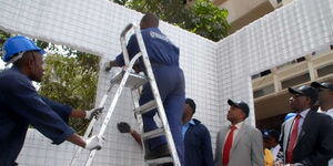 National Housing Corportaionworkers construct a sample EPS panels house in Nairobi.