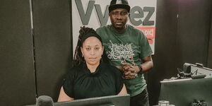 Radio presenter Nazizi Hirji (left) and Sheriff Juma pose for a photo inside Vybez Radio studios on January 31, 2023. 