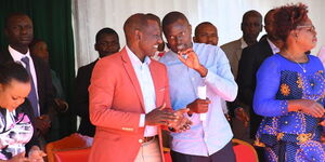 Deputy President William Ruto with MP Ndindi Nyoro uring an Akorino Church service in Thika, Kiambu County, on November 245, 2019.