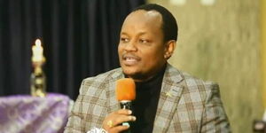 Former Nyeri Town Member of Parliament Ngunjiri Wambugu speaks at a past church service