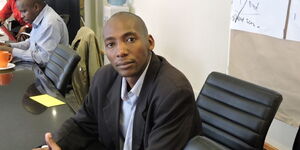 Novelist, writer and playwriter Alex Nderitu posing for a picture