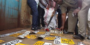 Police display fake number plates they recovered from car thieves  