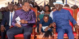 Former President Uhuru Kenyatta and opposition leader Raila Odinga at the burial of ex-Education CS Prof. George Magoha in Gem, Siaya County, on February 11, 2023