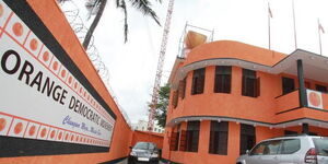 Orange Democratic Movement (ODM) logo plastered on a building.