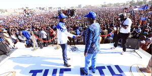 ODM party leader Raila Odinga and Wiper's Kalonzo Musyoka shake hands after Kalonzo endorsed him for the presidency at Jacaranda Grounds on Saturday, March 12, 2022