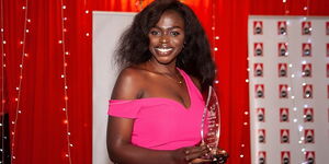 Photo of WEX Africa founder Ogutu Okudo poses with a trophy at the Women in Energy Awards gala in Nairobi in 2018