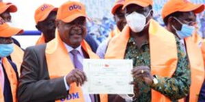 ODM Deputy Party Leader Governor Wycliffe Oparanya (right) issues a nomination certificate to party candidate for Matungu David Were (left) on January 6, 2021.