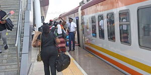 Passengers travel to Mombasa using a Madaraka Express train at the Nairobi terminus in Syokimau.